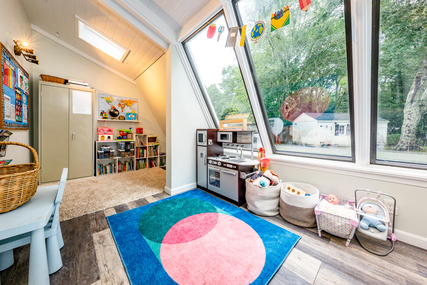 82 Skunknet Road Centerville, MA 02632 - Photo 15 of 35 a living room with furniture a rug and a floor to ceiling window