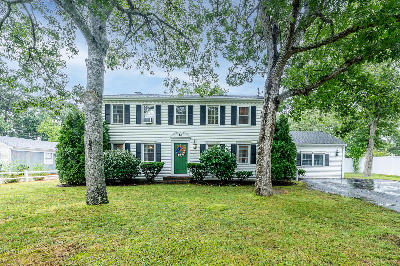 82 Skunknet Road Centerville, MA 02632 - Photo 2 of 35 a front view of a house with garden