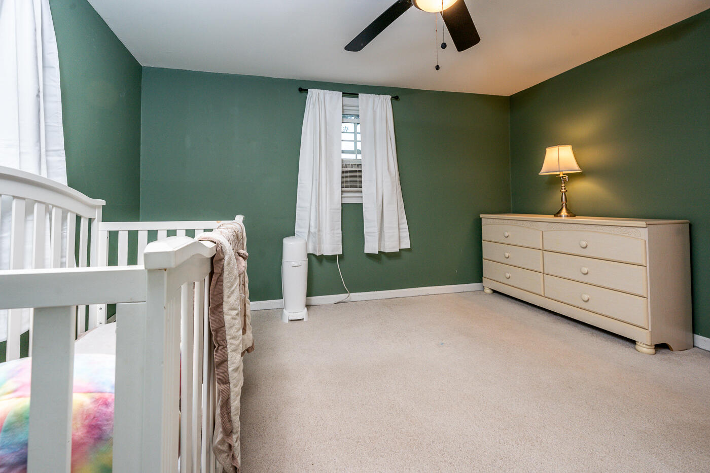 82 Skunknet Road Centerville, MA 02632 - Photo 25 of 35 a view of an empty room with a window and a kitchen