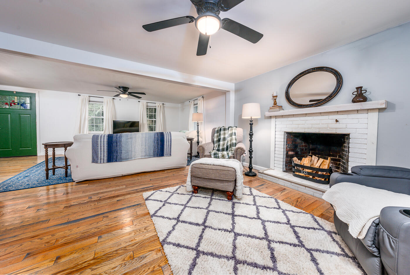 82 Skunknet Road Centerville, MA 02632 - Photo 4 of 35 a living room with furniture and a fireplace