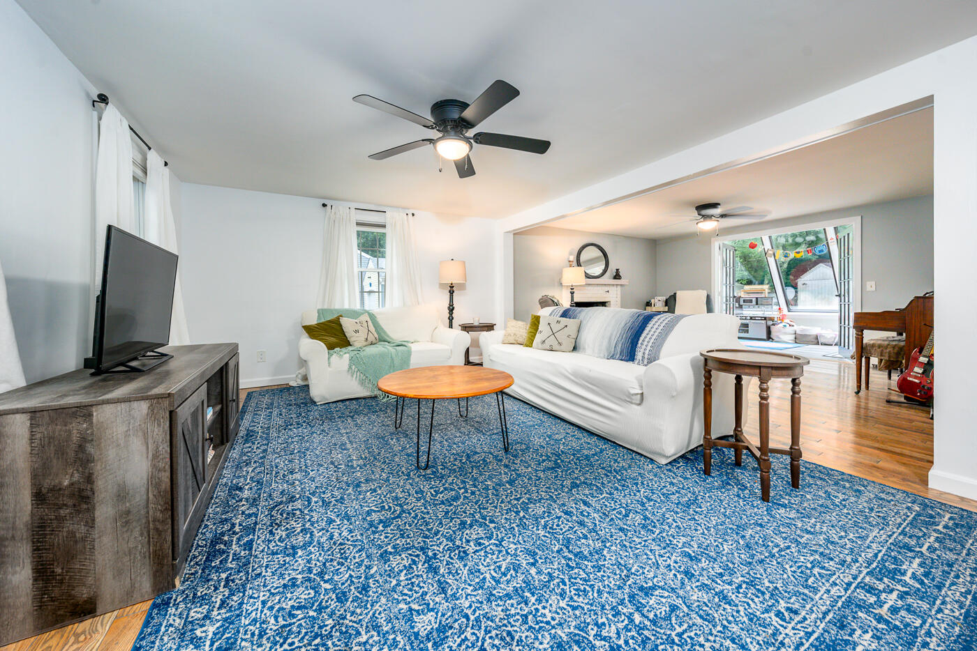 82 Skunknet Road Centerville, MA 02632 - Photo 5 of 35 a living room with furniture and a flat screen tv