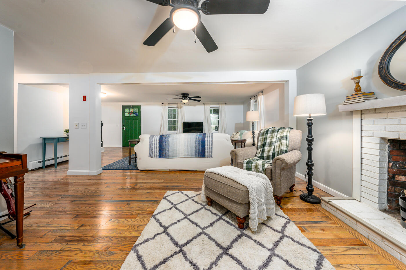 82 Skunknet Road Centerville, MA 02632 - Photo 6 of 35 a bedroom with furniture and a fireplace