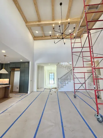 a large kitchen with kitchen island a large counter top space a sink and stainless steel appliances