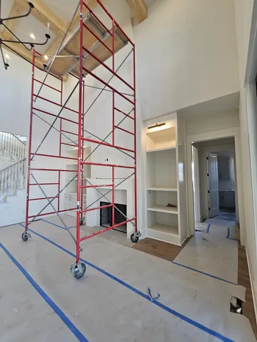a spacious bathroom with a double vanity sink and a mirror