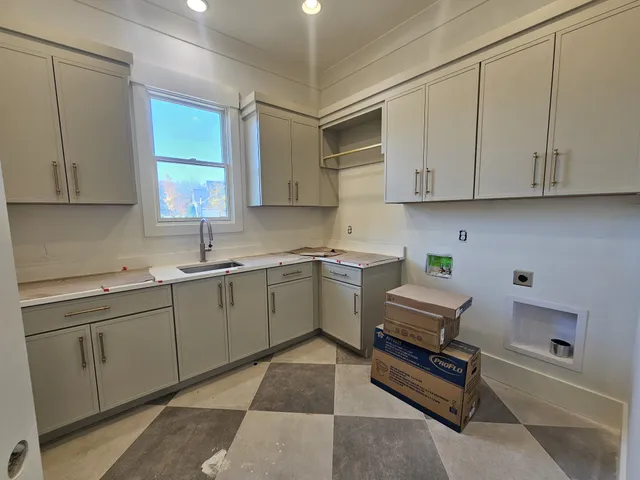 a view of a room with furniture and windows