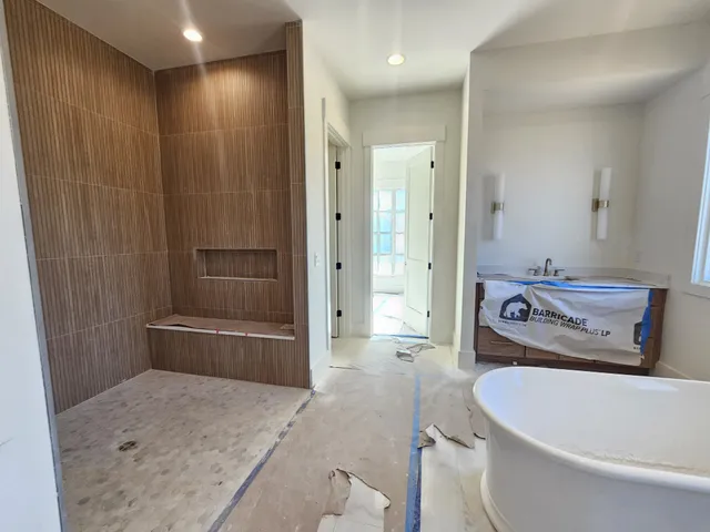 a bathroom with a toilet and a shower