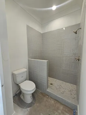 a view of cabinets a sink and dishwasher in a room