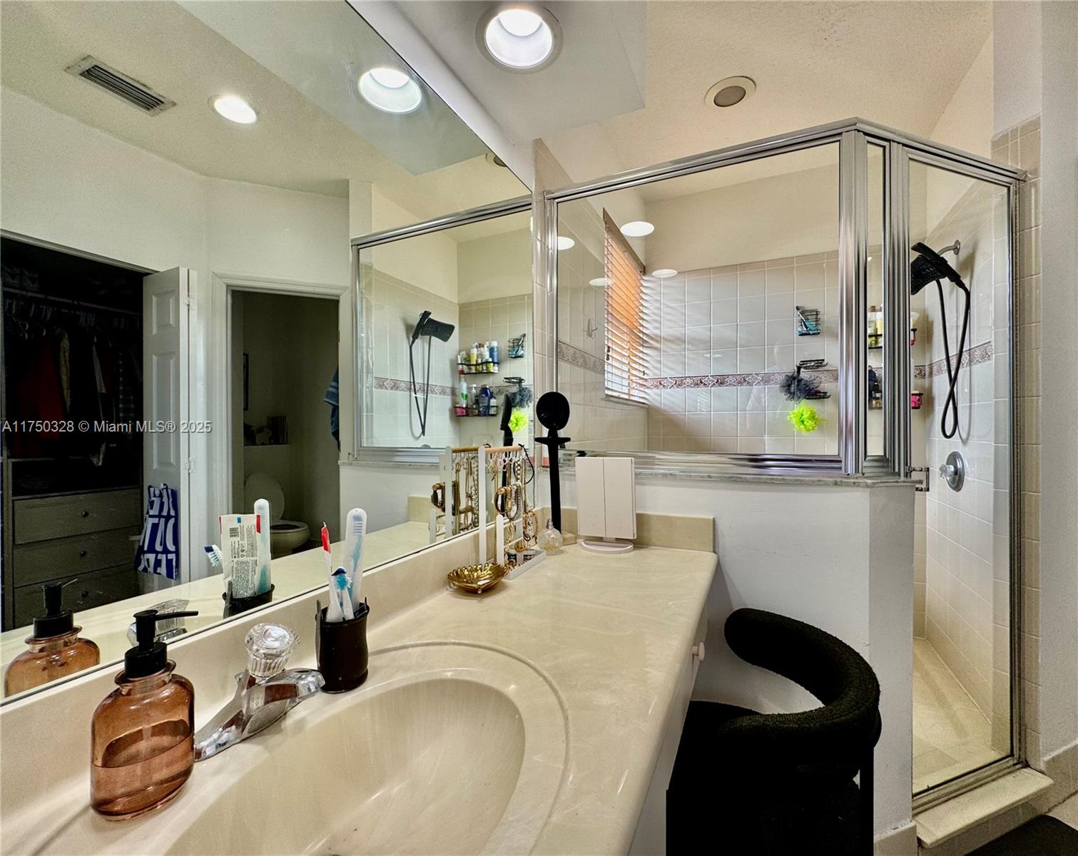 1542 Southeast 20th Road Homestead, FL 33035 - Photo 17 of 22 a bathroom with a sink double vanity and a mirror