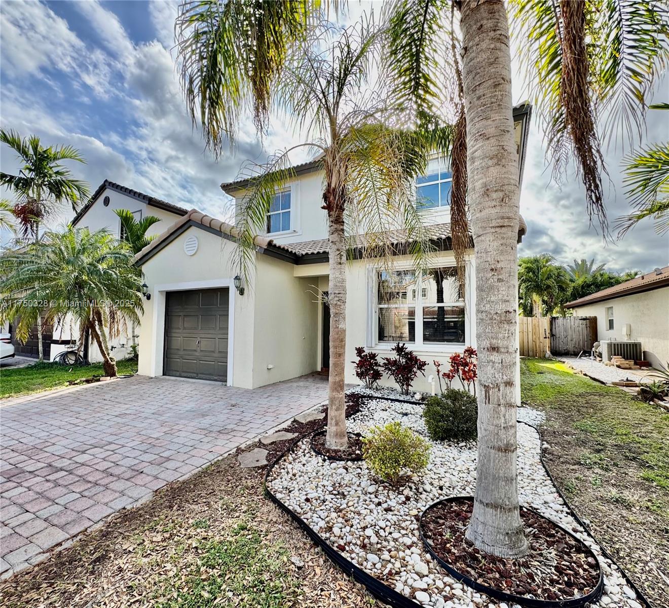 1542 Southeast 20th Road Homestead, FL 33035 - Photo 4 of 22 a front view of a house with garden