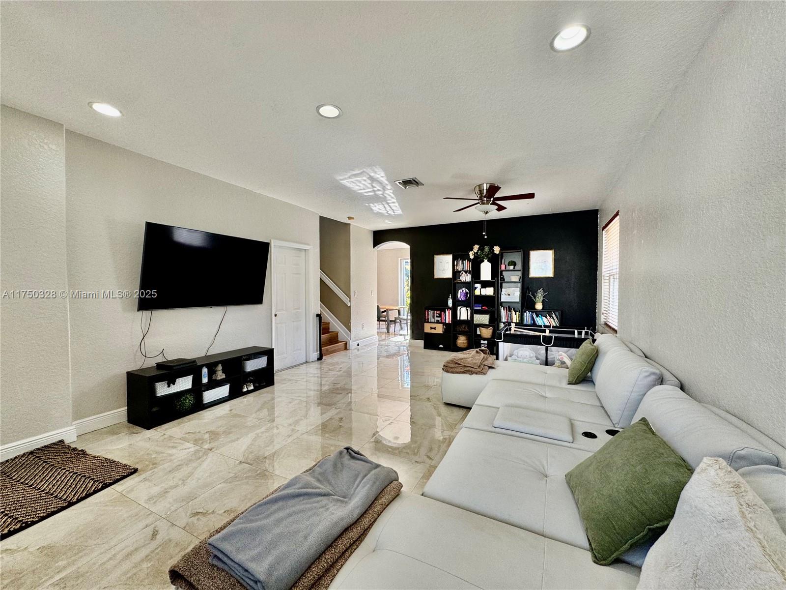 1542 Southeast 20th Road Homestead, FL 33035 - Photo 8 of 22 a living room with furniture and a flat screen tv