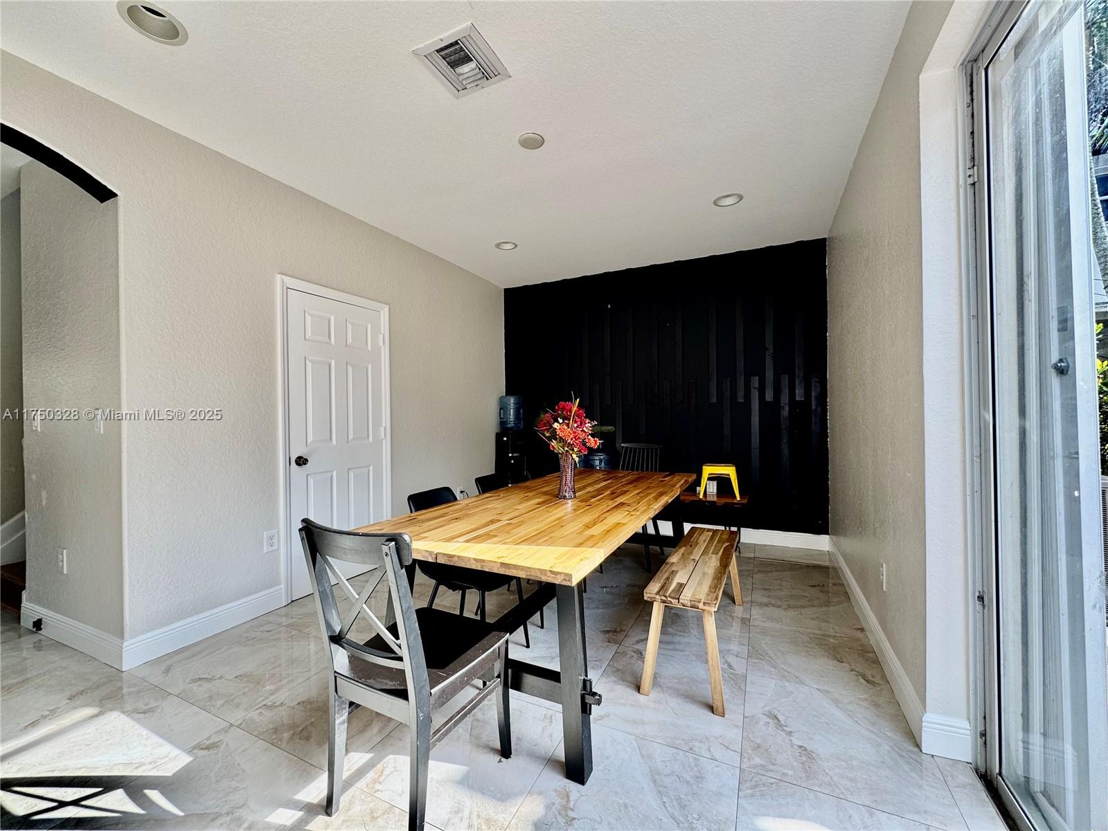 1542 Southeast 20th Road Homestead, FL 33035 - Photo 10 of 22 a view of a dining room with furniture