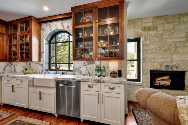a living room with fireplace furniture and a fireplace