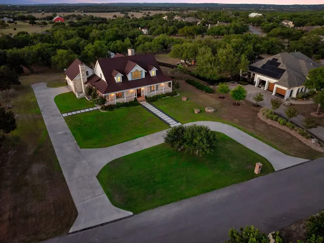 an aerial view of a house with outdoor space