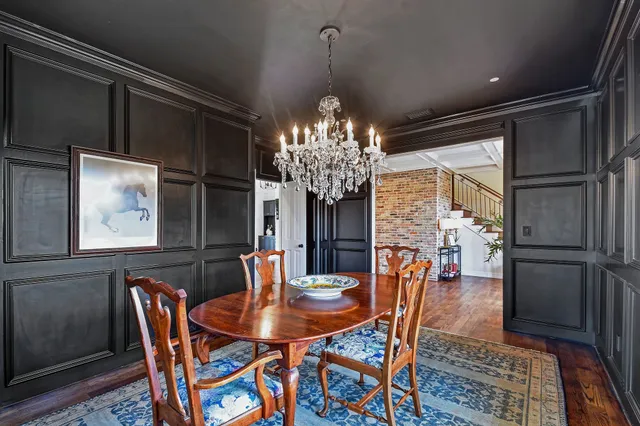 a kitchen with stainless steel appliances granite countertop a sink a stove and a wooden cabinets