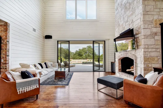 a living room with fireplace furniture and a fireplace