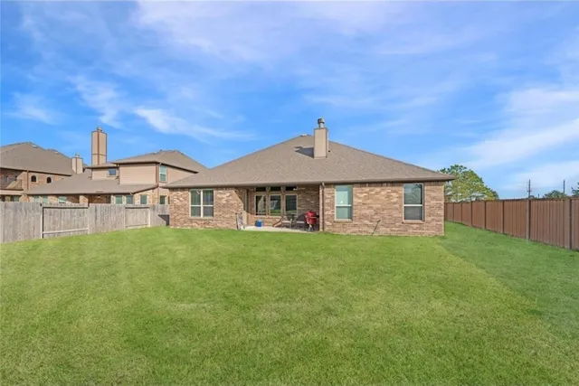 a front view of a house with yard
