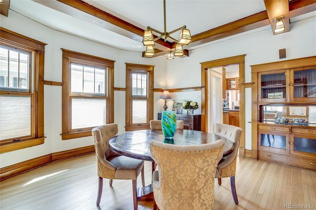 a kitchen with stainless steel appliances granite countertop a stove and a white cabinets