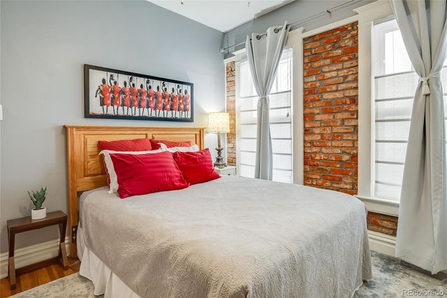 a living room with furniture and a painting