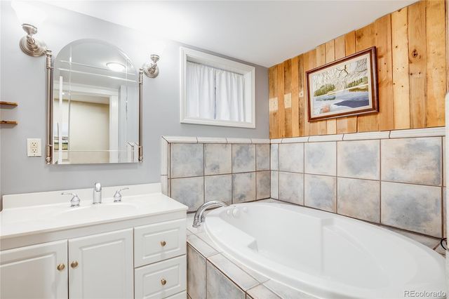 a kitchen with a sink a stove and cabinets