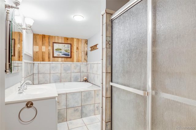 a bedroom with furniture and a fireplace