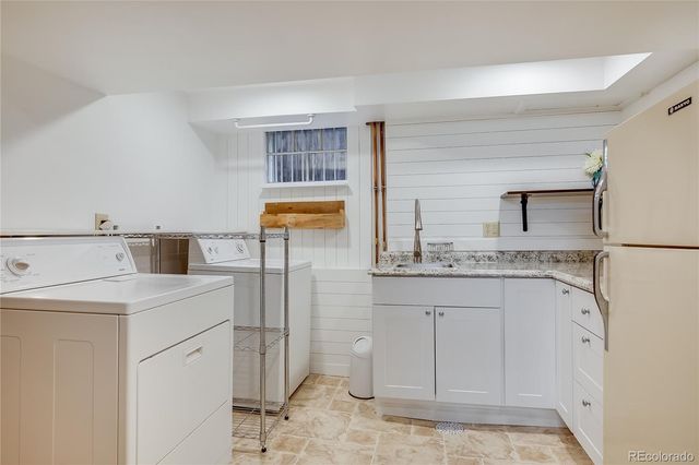 a bedroom with furniture and a fireplace