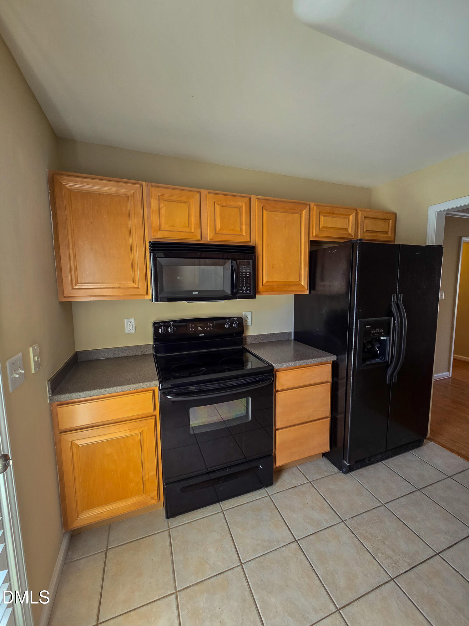 9819 Layla Avenue Raleigh, NC 27617 - Photo 11 of 35 a kitchen with stainless steel appliances granite countertop a refrigerator and a stove top oven