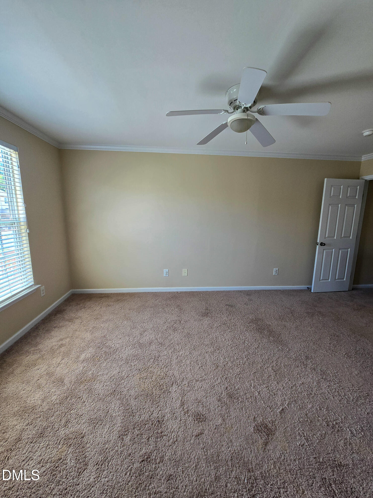 9819 Layla Avenue Raleigh, NC 27617 - Photo 20 of 35 an empty room with a window and a ceiling fan