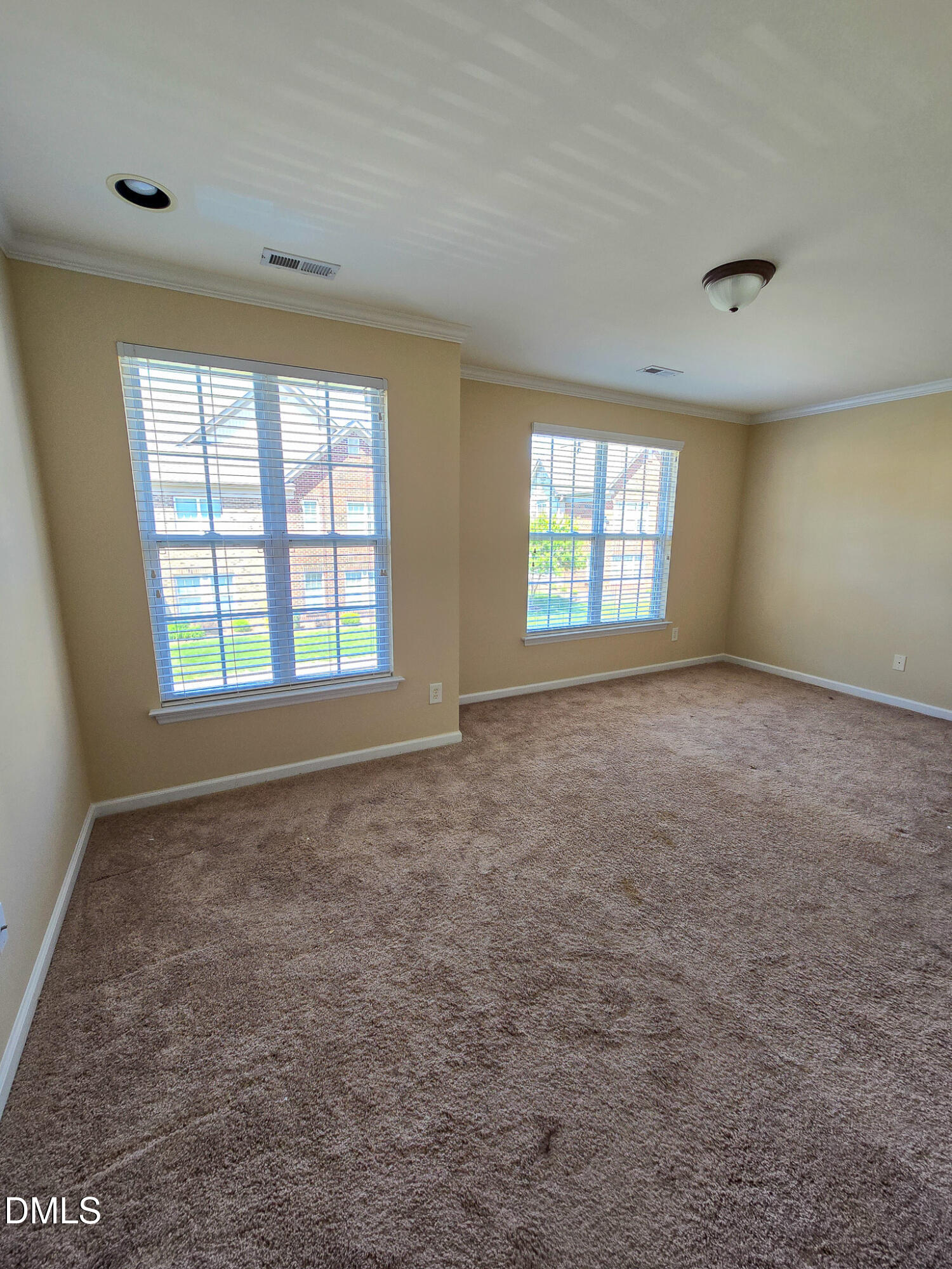 9819 Layla Avenue Raleigh, NC 27617 - Photo 23 of 35 an empty room with windows
