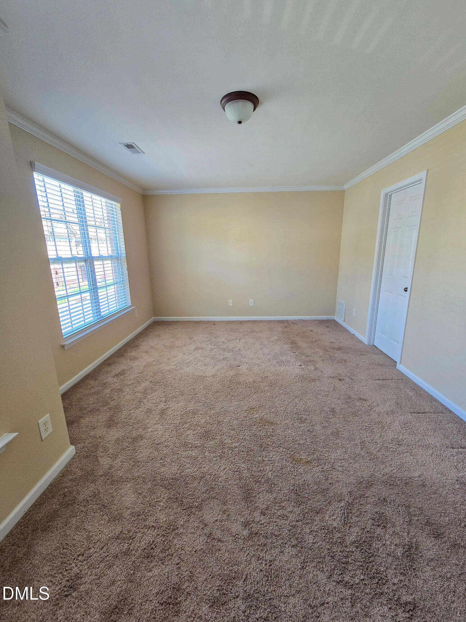 9819 Layla Avenue Raleigh, NC 27617 - Photo 24 of 35 an empty room with windows