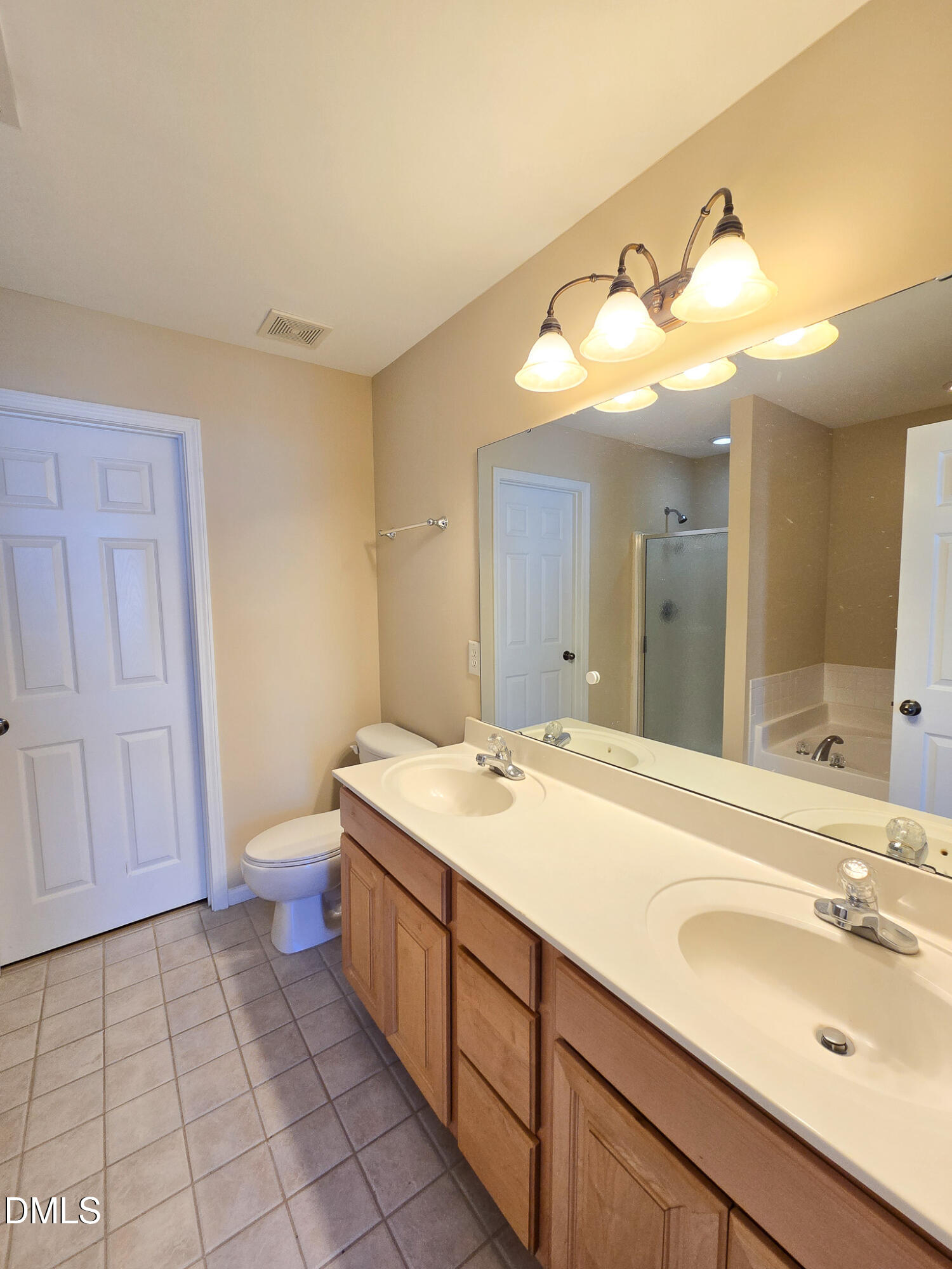 9819 Layla Avenue Raleigh, NC 27617 - Photo 27 of 35 a bathroom with a sink and a mirror