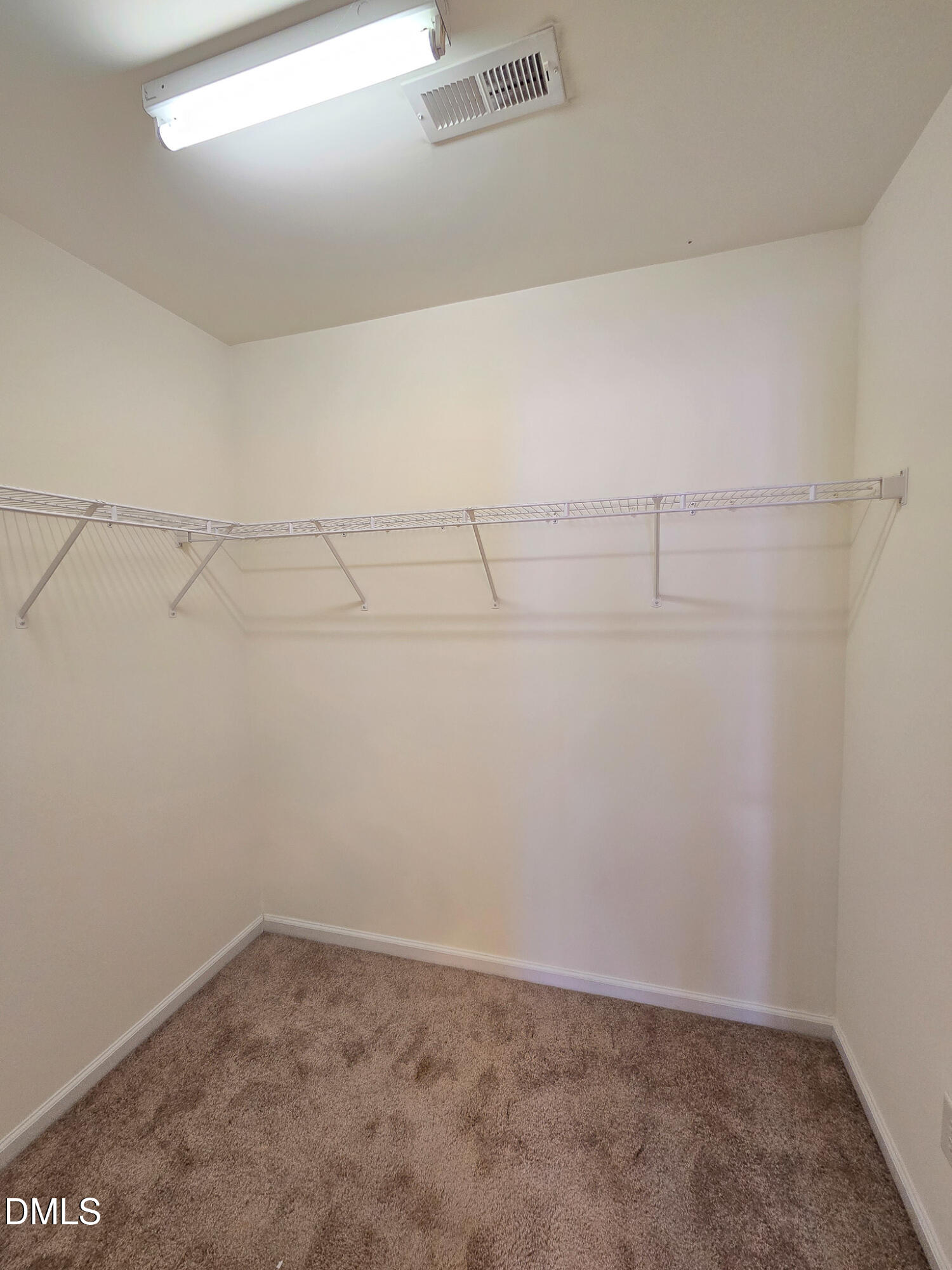 9819 Layla Avenue Raleigh, NC 27617 - Photo 29 of 35 a view of a room with racks on the wall