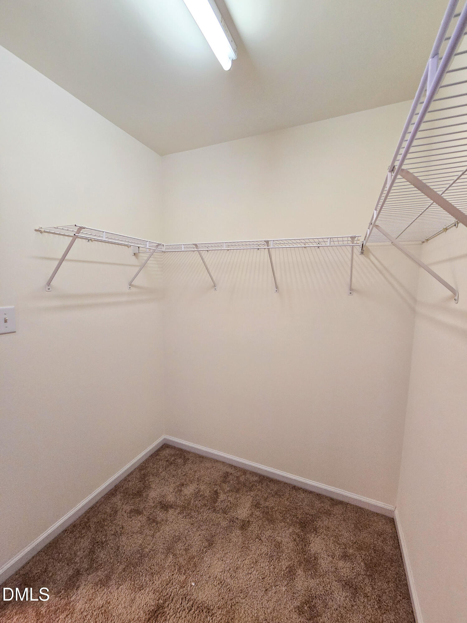 9819 Layla Avenue Raleigh, NC 27617 - Photo 30 of 35 a view of a room with racks on the wall