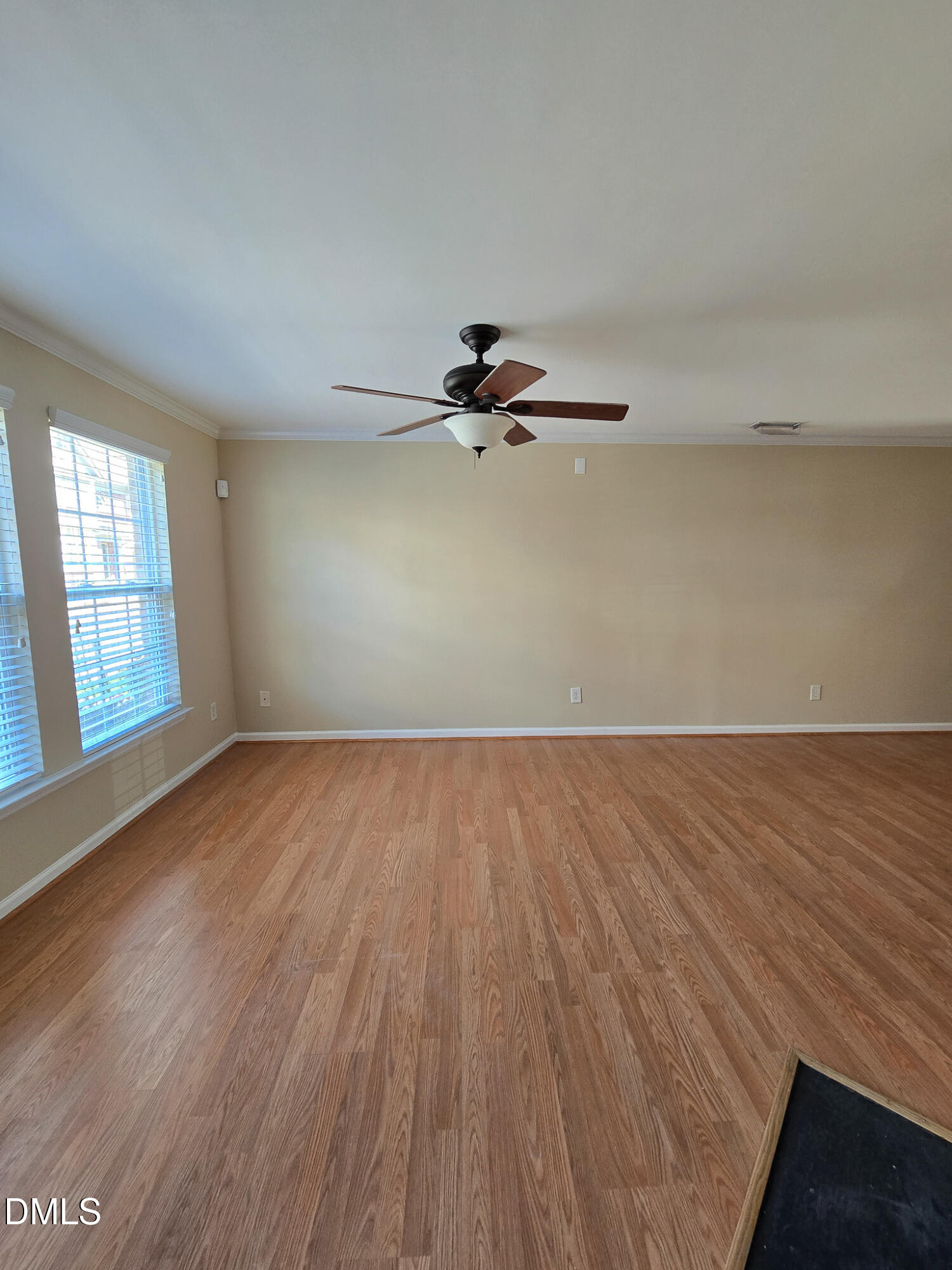9819 Layla Avenue Raleigh, NC 27617 - Photo 3 of 35 wooden floor in an empty room with a window