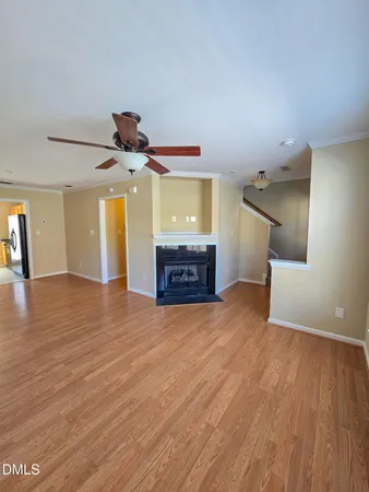 a view of a room with wooden floor and staircase