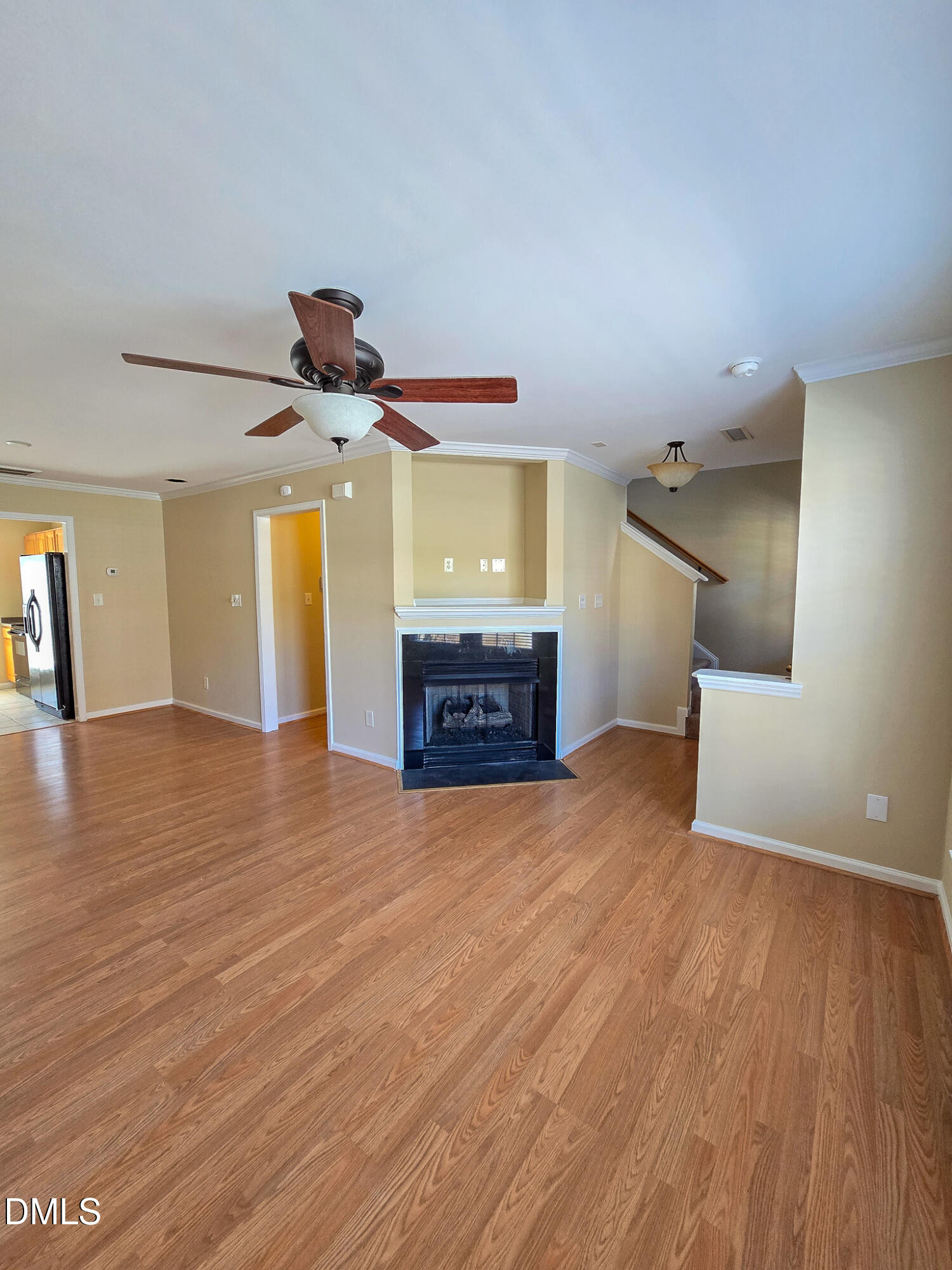9819 Layla Avenue Raleigh, NC 27617 - Photo 5 of 35 a view of a room with wooden floor and staircase