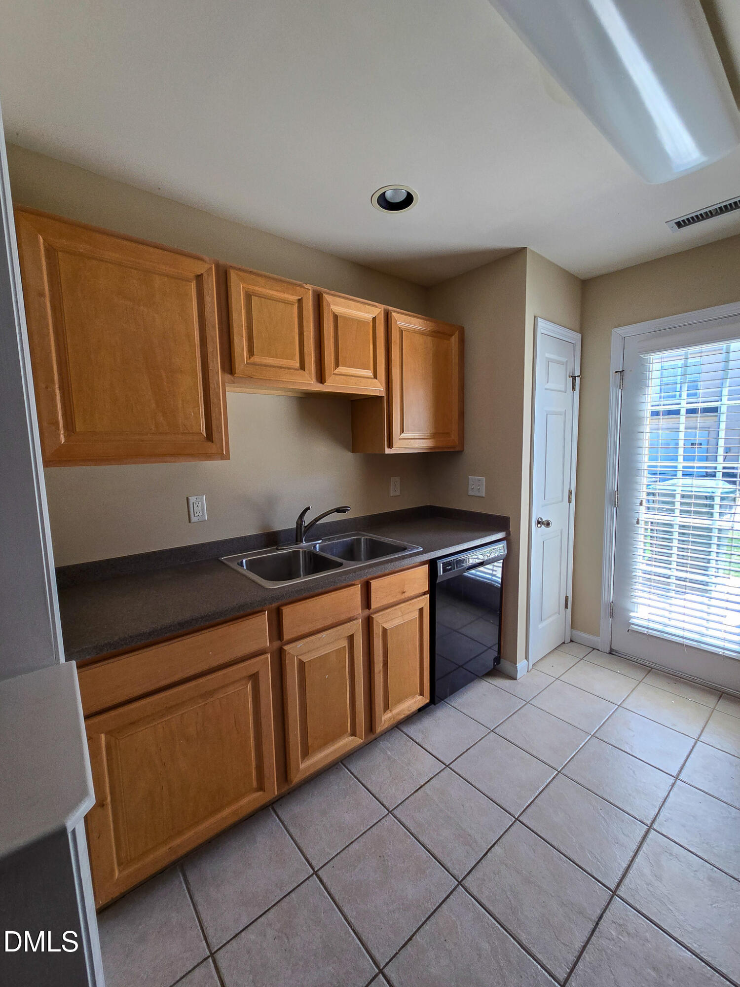9819 Layla Avenue Raleigh, NC 27617 - Photo 10 of 35 a kitchen with stainless steel appliances granite countertop a sink and a stove
