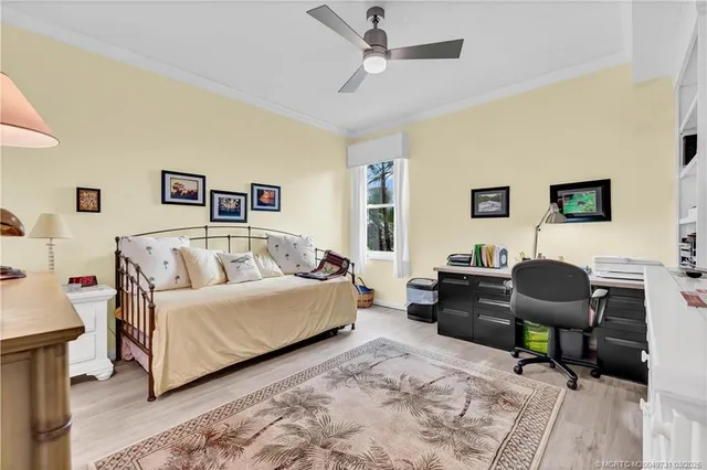 a view of a livingroom with workspace and a couch