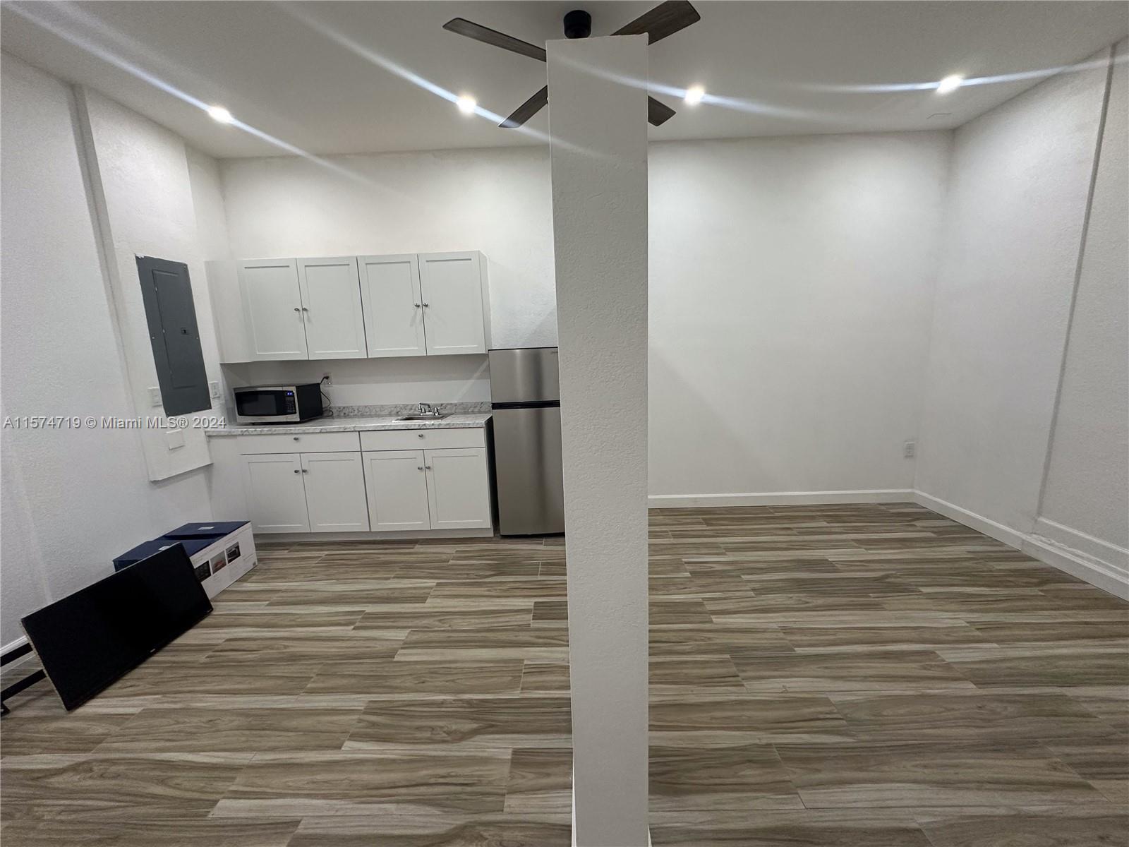27176 Southwest 132 Ct Road, Unit 2 Homestead, FL 33032 - Photo 6 of 10 a view of a kitchen with a sink and cabinets