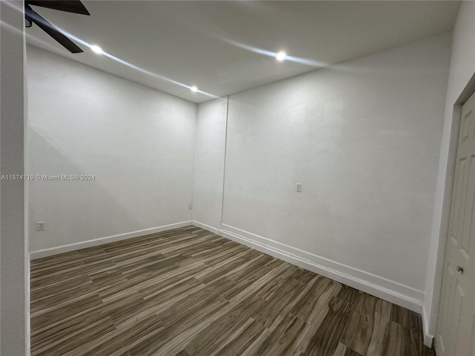 27176 Southwest 132 Ct Road, Unit 2 Homestead, FL 33032 - Photo 7 of 10 a view of room with wooden floor