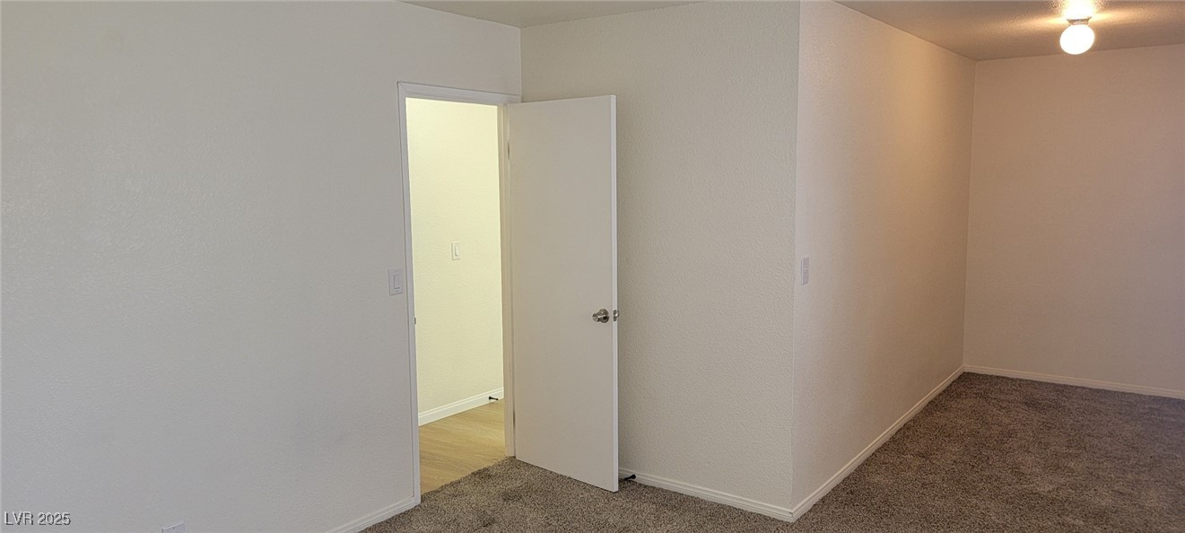 5196 Golden Lane, Unit C Las Vegas, NV 89119 - Photo 22 of 29 Spare room with light carpet and baseboards