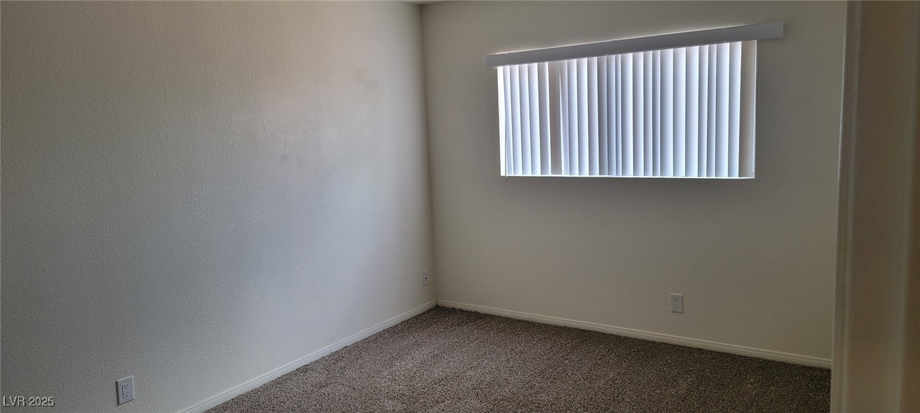 5196 Golden Lane, Unit C Las Vegas, NV 89119 - Photo 24 of 29 Spare room with carpet flooring and baseboards