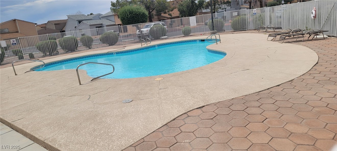 5196 Golden Lane, Unit C Las Vegas, NV 89119 - Photo 28 of 29 Community pool featuring a patio and a residential view