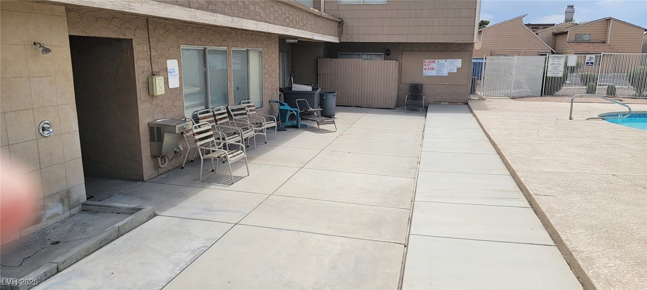 5196 Golden Lane, Unit C Las Vegas, NV 89119 - Photo 29 of 29 View of patio / terrace with a community pool
