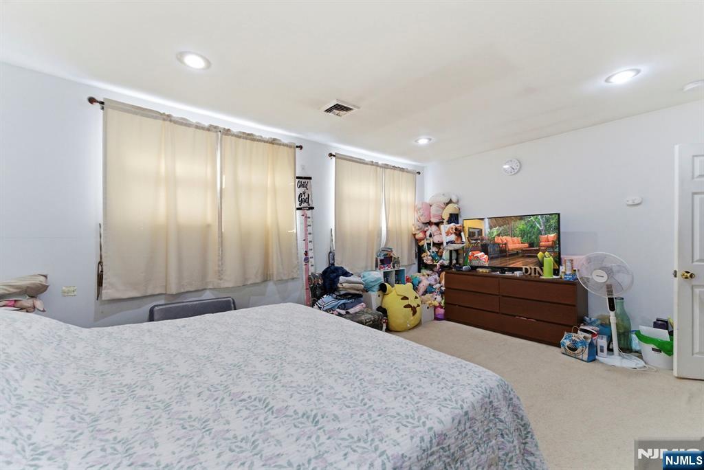 270 Westervelt Place Lodi, NJ 07644 - Photo 8 of 17 a bed room with furniture and wooden floor