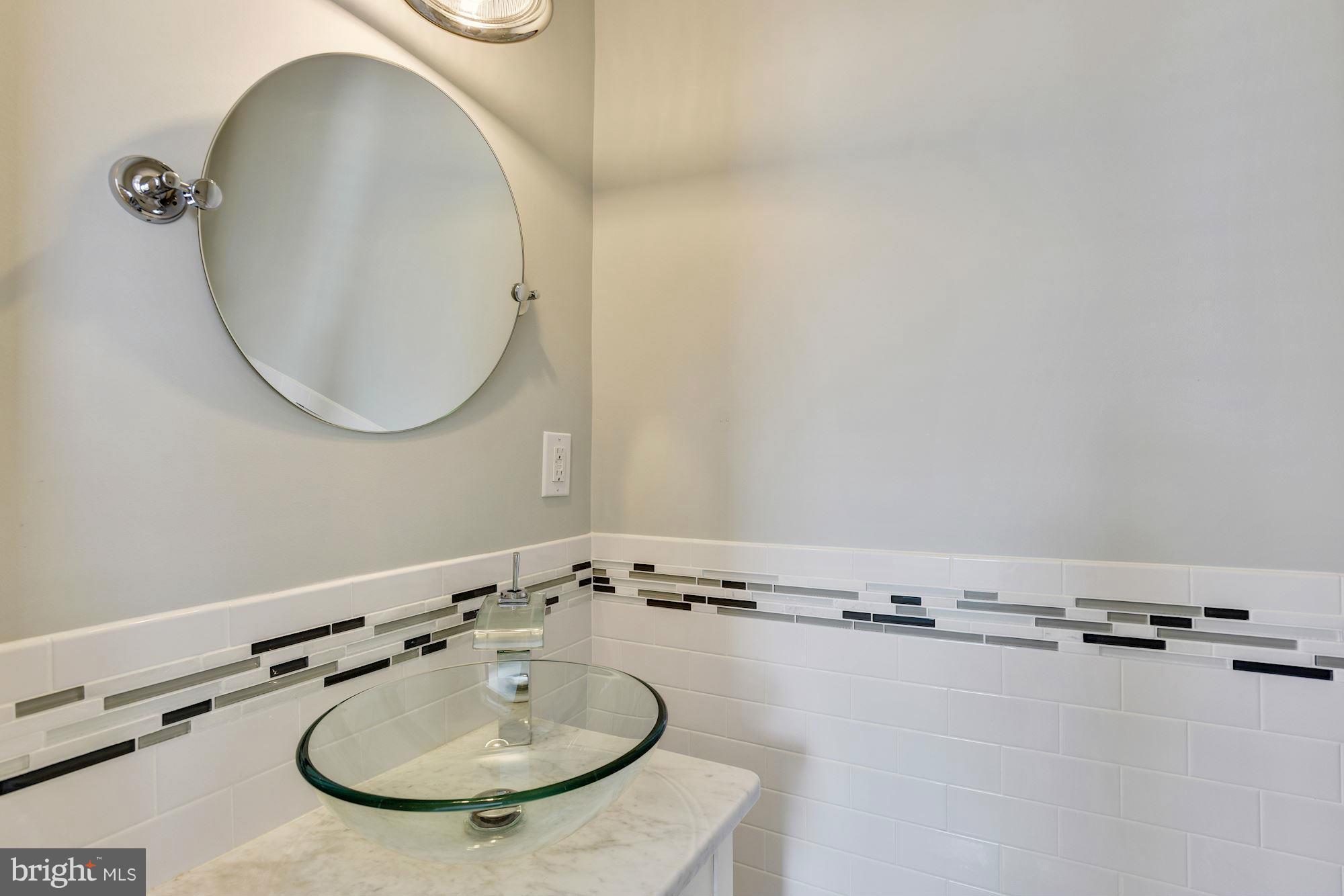 1966 Edgewood Road Baltimore, MD 21286 - Photo 14 of 26 a bathroom with a sink and a mirror