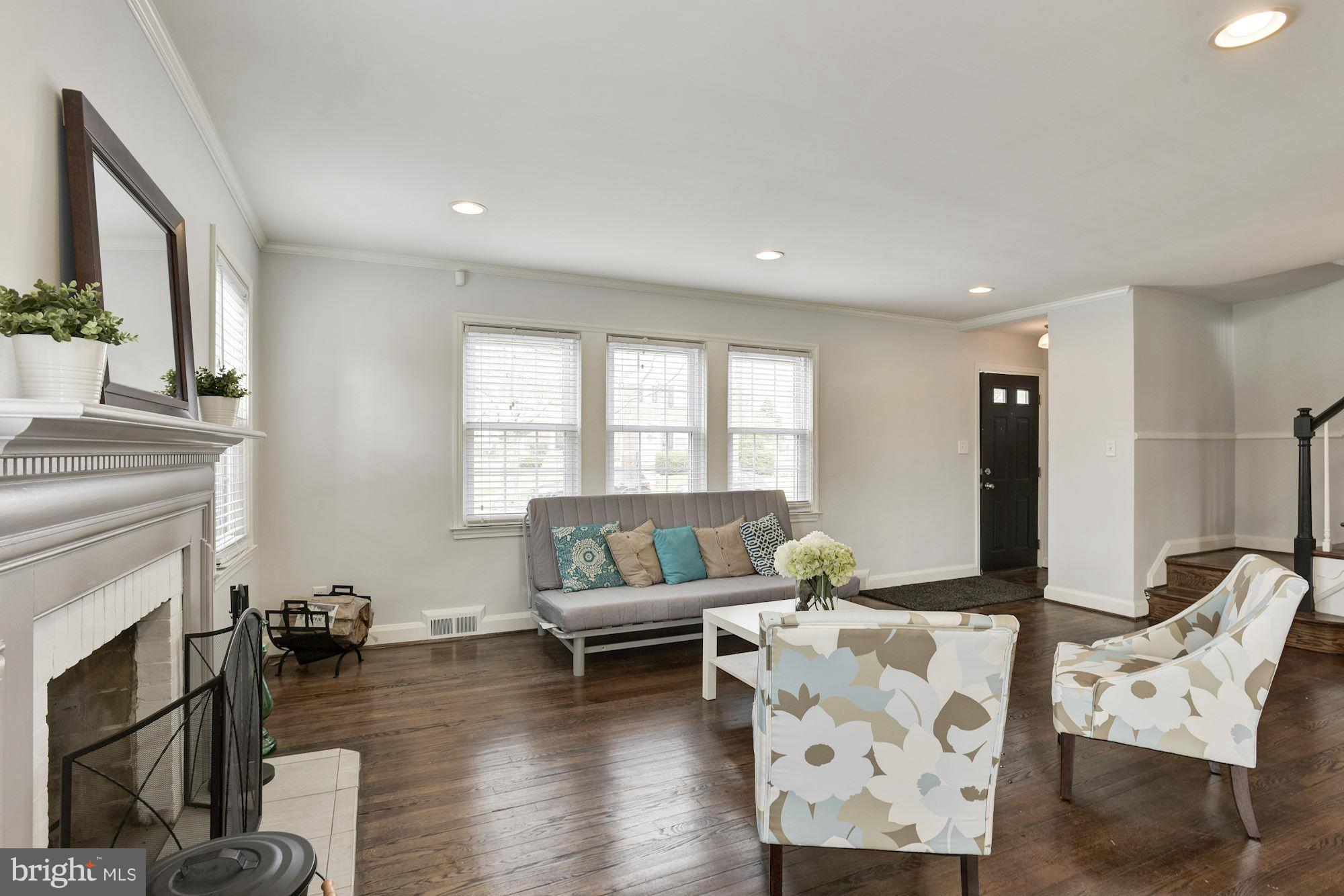 1966 Edgewood Road Baltimore, MD 21286 - Photo 5 of 26 a living room with furniture and a fireplace