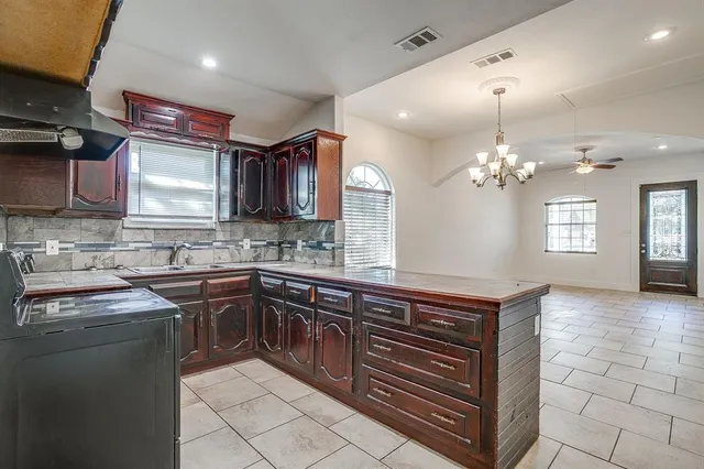a kitchen with a sink and cabinets
