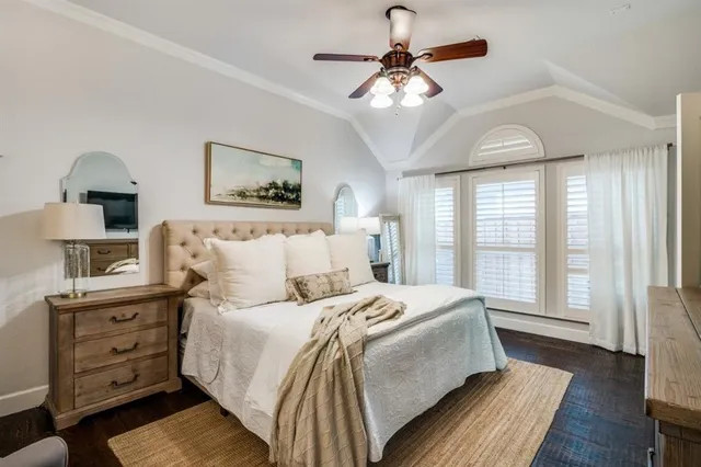 a spacious bedroom with a large bed and a window