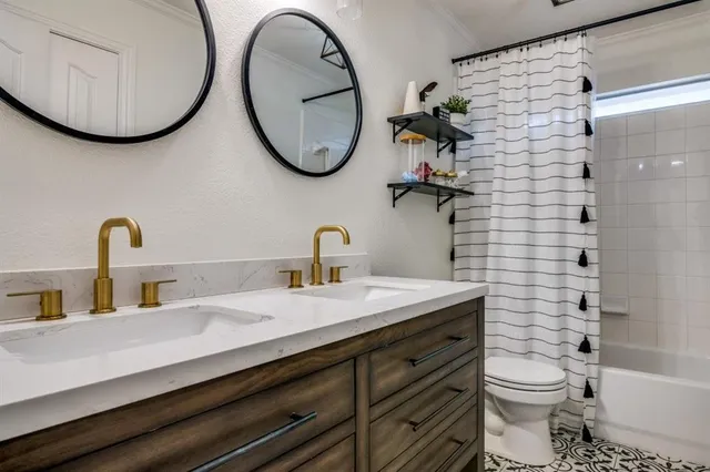 a bathroom with a double vanity sink and a mirror