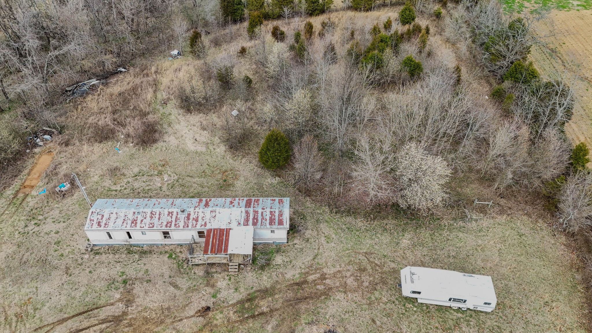 2613 Chambliss Road Pleasant View, TN 37146 - Photo 14 of 20 a stone house with a yard